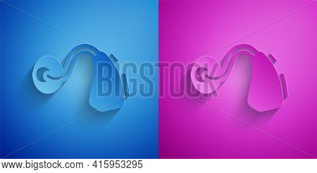 Paper Cut Hearing Aid Icon Isolated On Blue And Purple Background. Hearing And Ear. Paper Art Style.