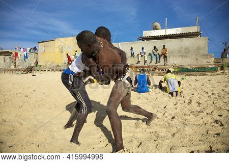 Saint-louis, Senegal, December 4: Unidentified Group Of Wrestlers Training On The Beach. The Senegal