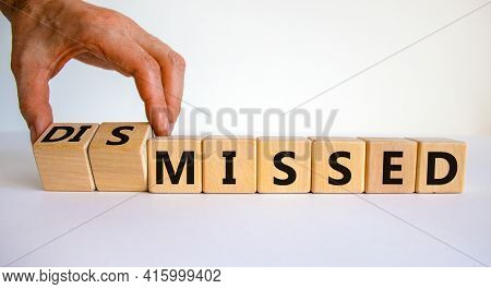 Missed Or Dismissed Symbol. Businessman Turns Cubes And Changes The Word 'missed' To 'dismissed'. Be