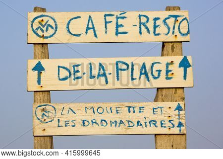 Sidi Kaouiki, Morocco - 25/08/2014:  Signs Advertising A Cafe On The Beach Of A Deserted Holiday Res