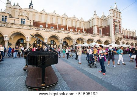 KRAKOW, POLAND - SEN 8: View of the Main Square, Sen 8, 2013 in Krakow, Poland. It dates to the 13th century, and at roughly 40,000 m Ã?ÃÂ¢?? it is the largest medieval town square in Europe.