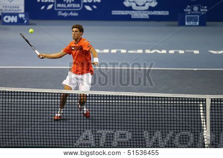 KUALA LUMPUR - SEPTEMBER 24: Pablo Carreno Busta (Spain) hits a return in a first round tennis match at the Malaysian Open 2013 played at the Putra Stadium, Malaysia on September 24, 2013.