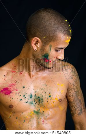 Handsome Young Man Painted And Sprayed With Honi Color On His Skin