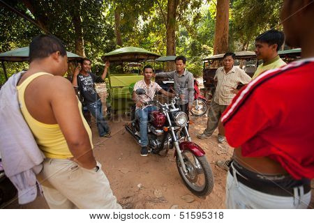SIEM REAP, CAMBODIA - DEC 13: Unidentified cambodian moto-rickshaws in Angkor Wat, Dec 13, 2012 on Siem Reap, Cambodia. Angkor is the country's prime attraction for visitors.