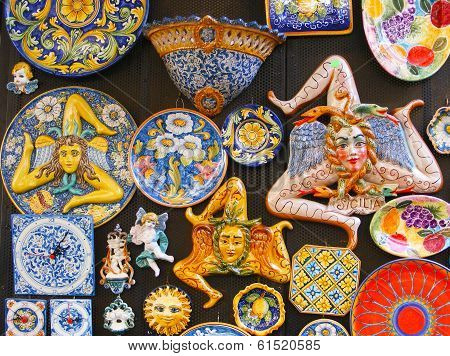 The Trinacria symbol of Sicily and typical Sicilian glazed ceramic