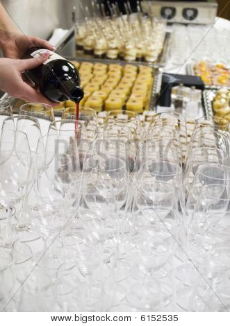 Waitress Filling a Wineglass
