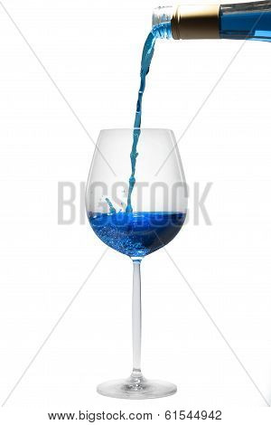 pouring blue liquid in a glass