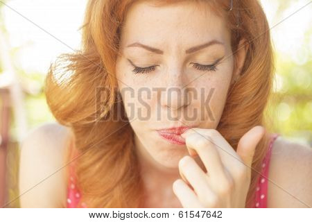 Pin-up girl tasting dessert