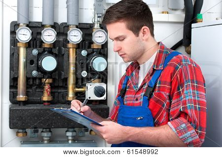 Technician Servicing Heating Boiler