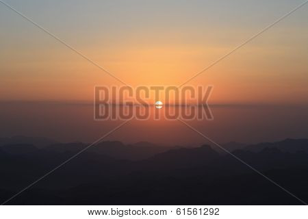 sunset over the mountains silhouette