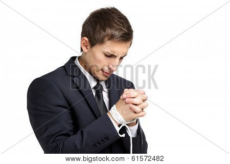 Half-length portrait of business man with tied hands, isolated on white. Concept of slavery and hard work