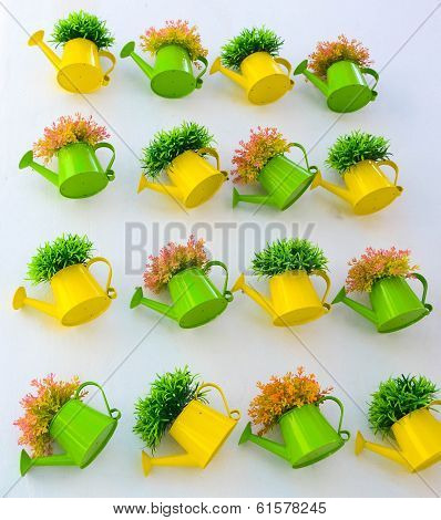 Beautiful Plastic Plant In Watering At Wall