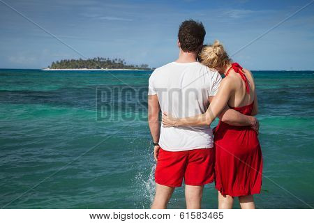 Couple At The Sean With Desert Island In Background