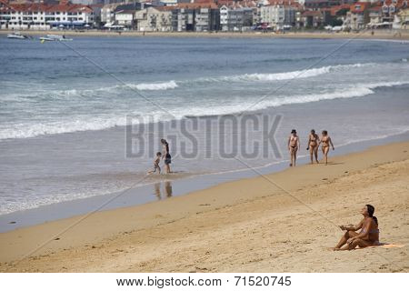 BAIONA, GALICIA, SPAIN - AUGUST 30: People at the beach, on August 30, 2014 in Baiona, Galicia, Spain.