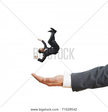 big palm catching small frightened businessman. isolated on white background