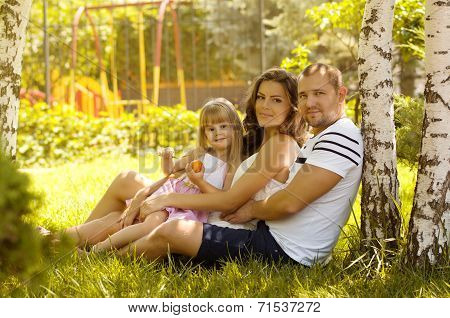 Pretty smiling family and daughter