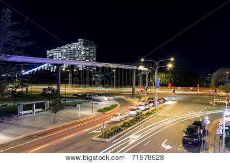 Broadbeach nightscape, G:link light rail zooming past traffic