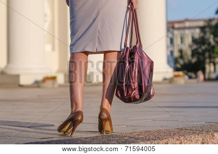 Legs of woman in the street