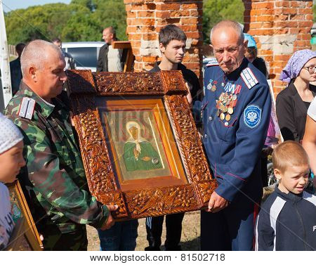 Two Men Holding Icon