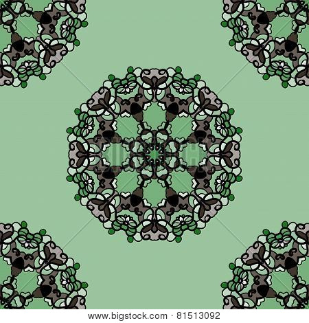 Seamless green mandala flower. Ornamental kaleidoskopic wallpaper.