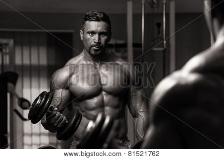Bodybuilder Exercising Biceps