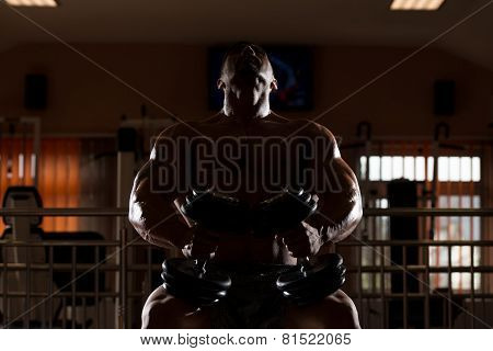 Bodybuilder Doing Heavy Weight Exercise For Chest