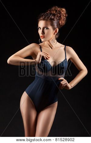 The Girl In A Bathing Suit With Curly Hair.