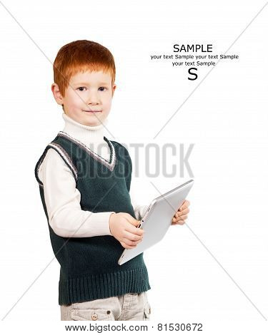 Cute Red Haired Child Stands With A Tablet Pc. Isolated At The White Background. Place For Your Text