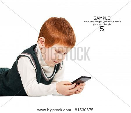 Cute Red Haired Child Poses With Tablet Pc And Smartphone. Isolated. Place For Your Text