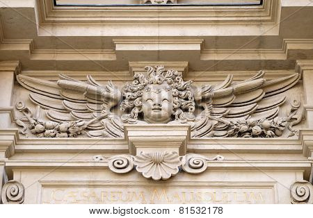GRAZ, AUSTRIA - JANUARY 10, 2015: Angel on the portal of St. Catherines church and Mausoleum of Ferdinand II, Graz, Austria on January 10, 2015.