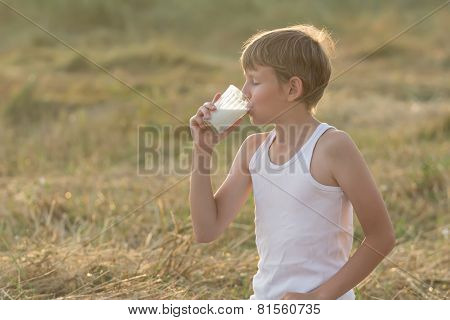Teenage Boy With Closed Eyes Drinking Milk