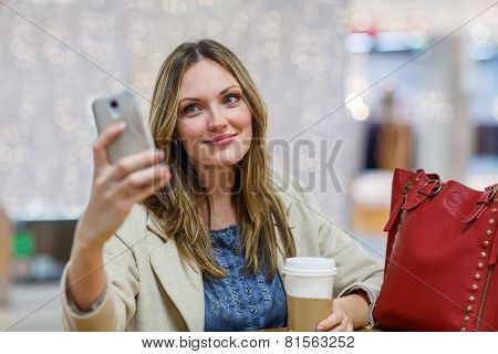 Young Woman  At International Airport, Making Selfie With Mobile