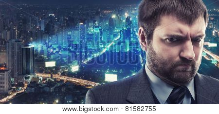Morose businessman against city