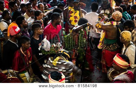 KUALA LUMPUR, MALAYSIA - JANUARY 31, 2015: Hindu devotees perform prayers at the Sri Mahamarriamman temple inside Batu Caves. Hundreds of thousands of devotees come here for the Thaipusam prayers.