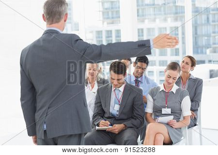 Business people listening during meting in office