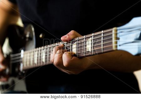 Man Playing On Guitar