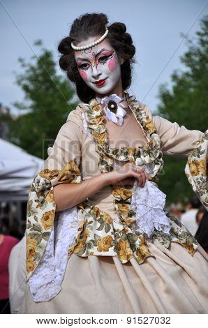 Artists On Stilts Performing In Medieval Costumes