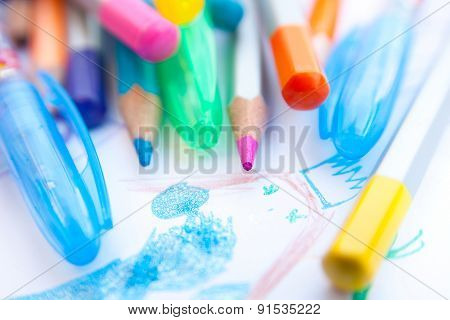 Colored Pencils And Child's Drawing