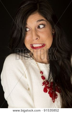 Intense Teeth Gritted Facial Expression On A Dark Complected Woman
