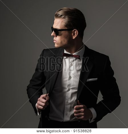 Tough sharp dressed man in black suit 