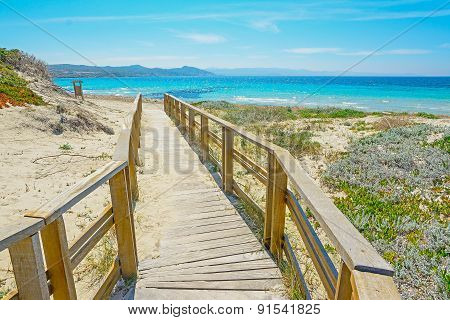 Wooden Boardwalk To The Beach In Capo Testa