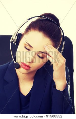Portrait of anoyed support phone operator in headset