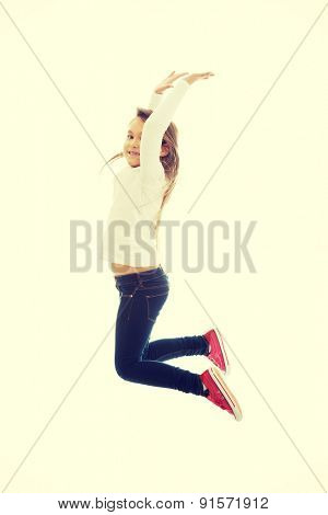 Little pretty girl jumping with joy