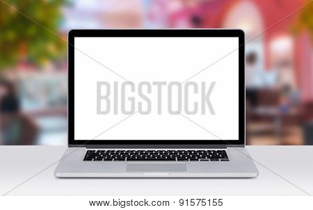 Laptop On The Desk Surface In Coffee Shop Mockup
