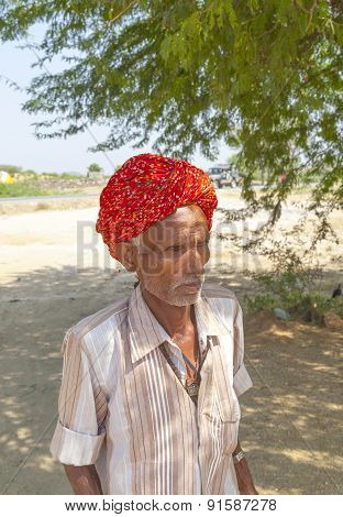 A Rajasthani Tribal Man Wearing Traditional Colorful Turban