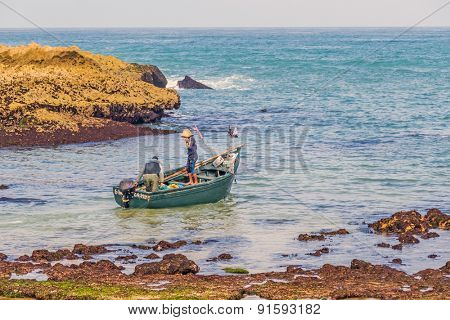 OUALIDIA, MOROCCO, APRIL 6, 2015: Fishermen  go to sea in fishing boat