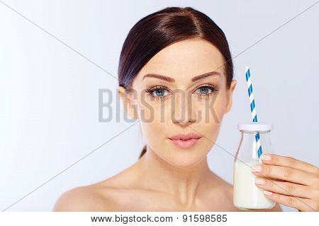 young woman with a glass of milk