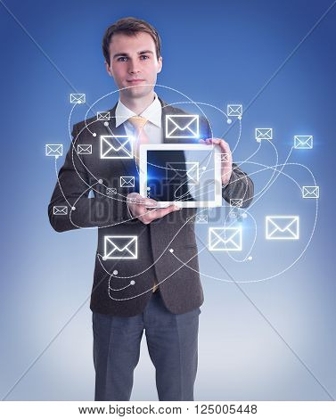 Businessman holding smartphone pictures of envelopes around. Blue background. Concept of contact.