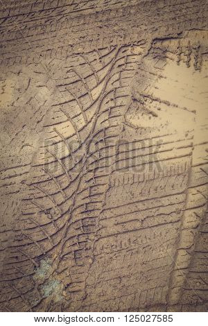 wheel trace off road on muddy soil