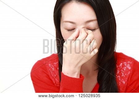 portrait of woman suffers from Asthenopia on white background